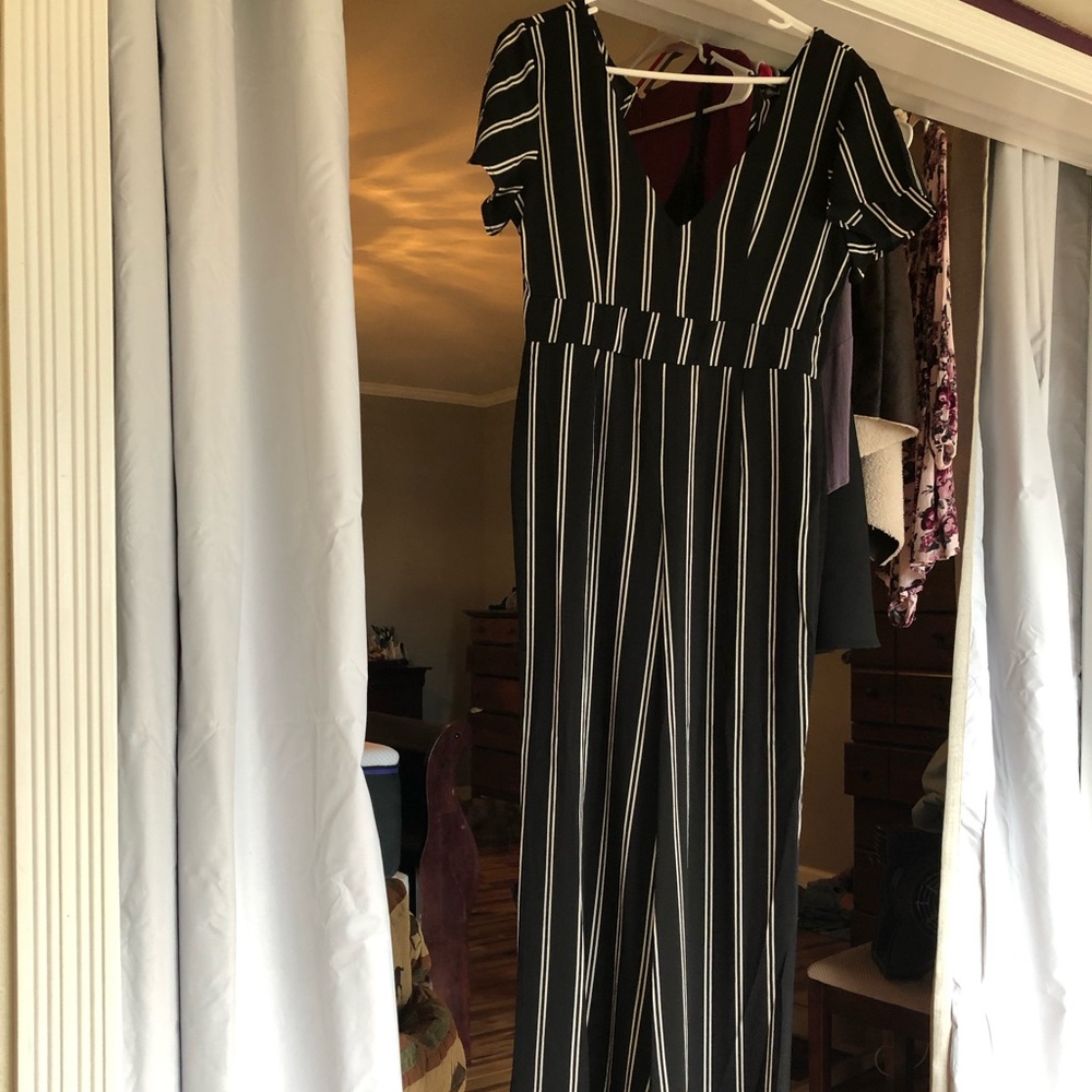 Black &  white stripe jump suit . Great condition.